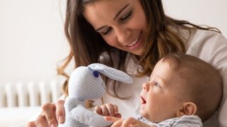 Mom and baby playing with a toy
