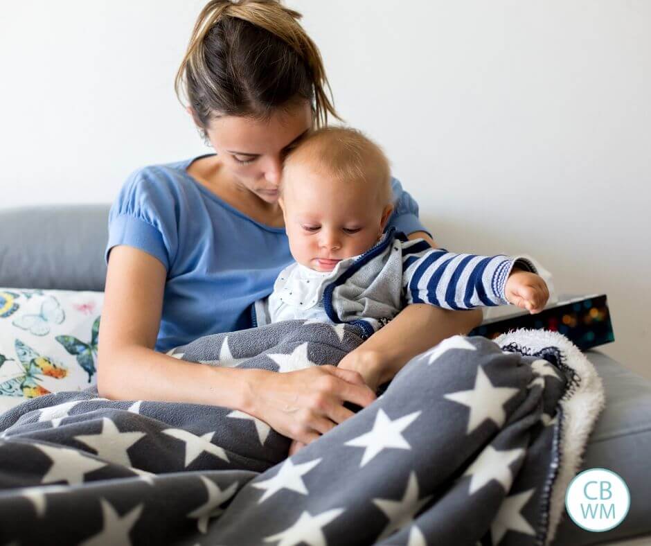 Mom comforting a sick baby