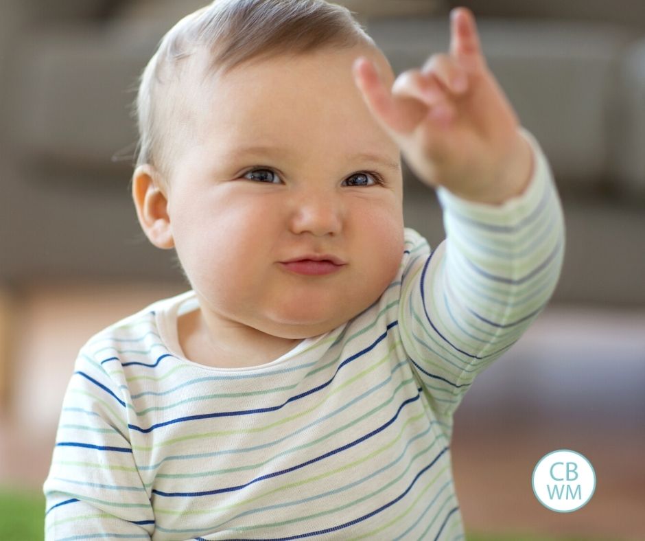 baby doing sign language