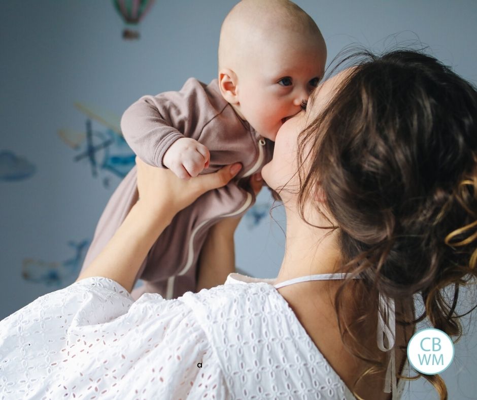 mom kissing baby