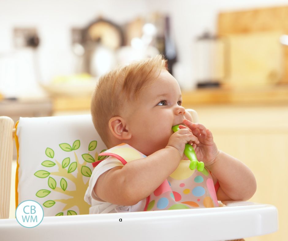 Baby sitting in high chair