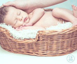 Baby sleeping in a basket