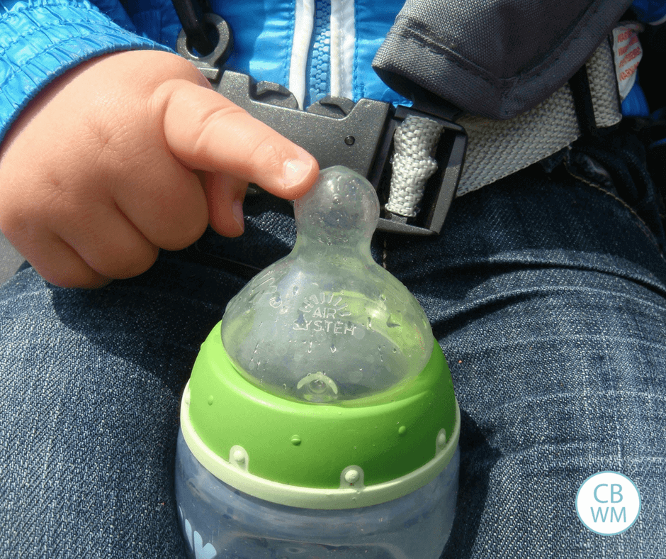 Baby holding a bottle