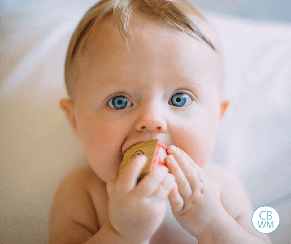 Baby playing with a block