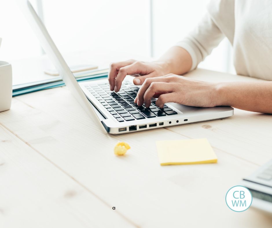 woman typing on a computer