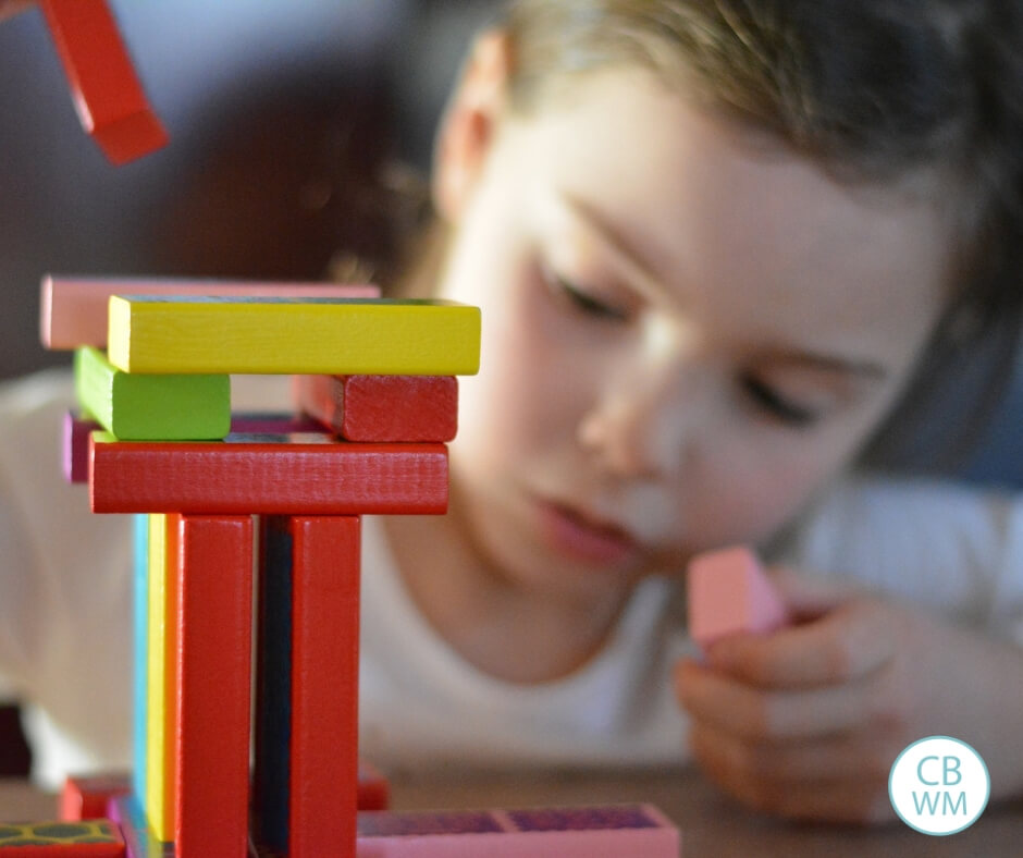 Girl playing with blocks independently