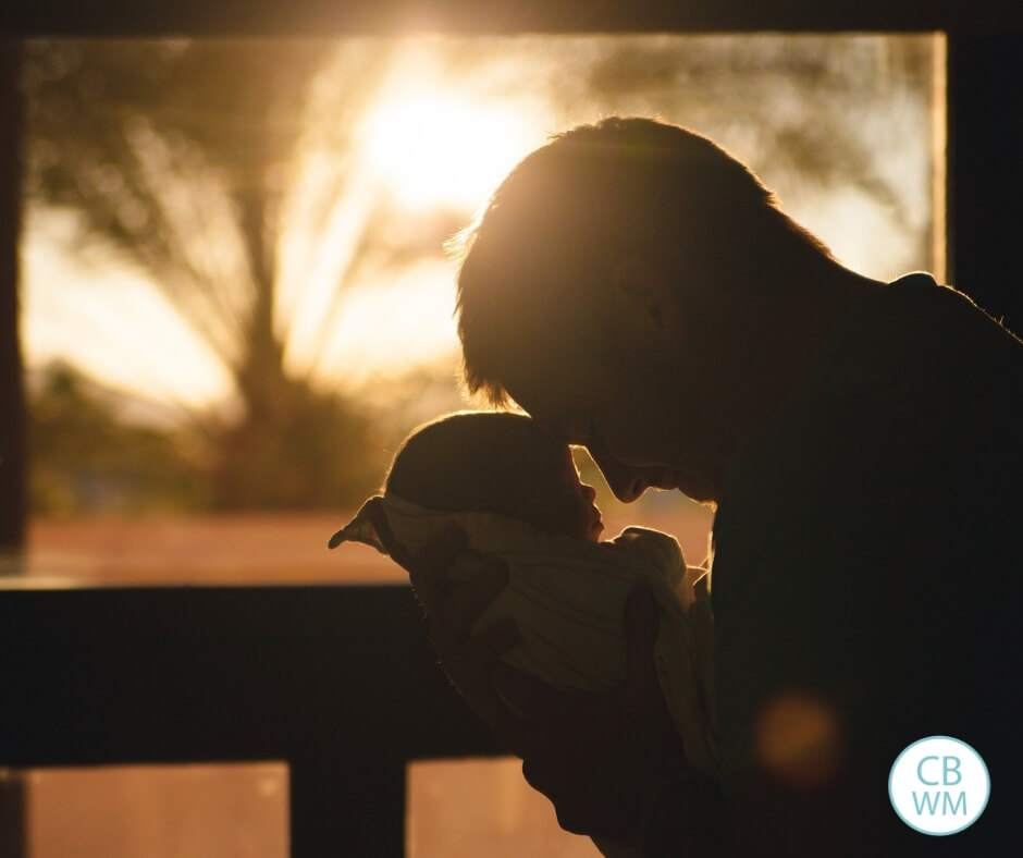 Father holding baby silhouette 