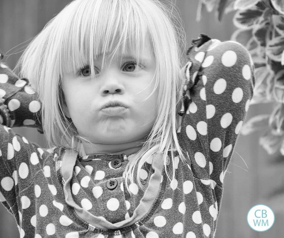 Defiant looking girl in black and white photo