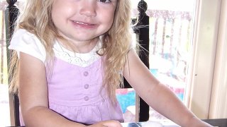 Preschooler doing a learning activity at home