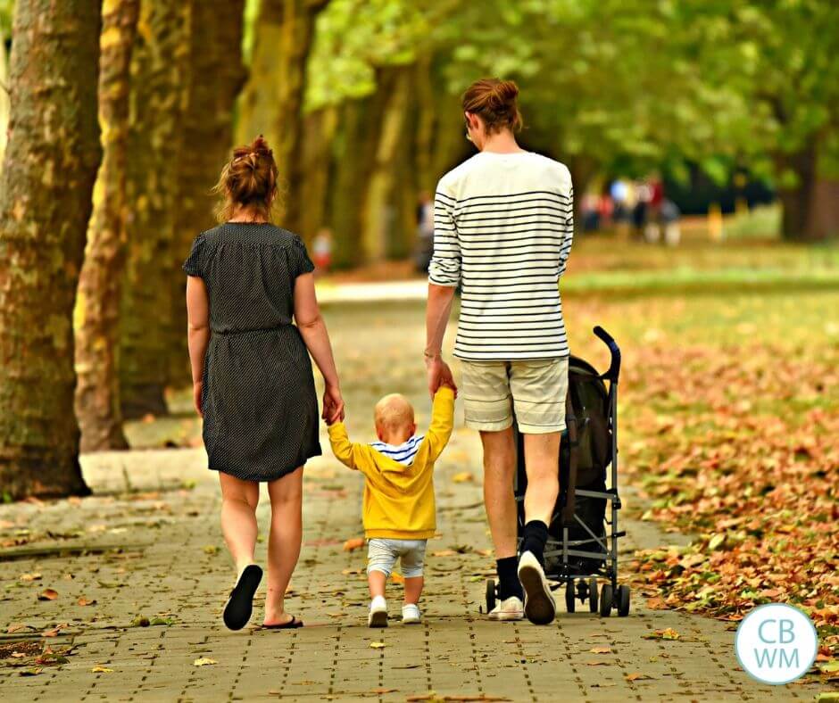 parents walking with young child