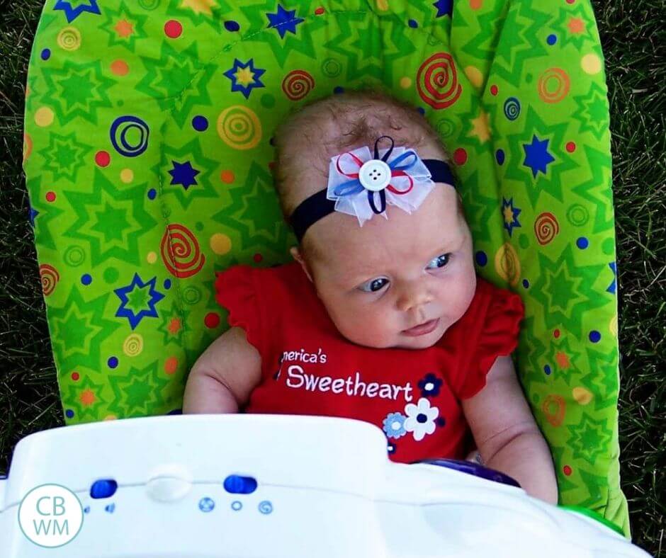 15 week old baby sitting in a bouncer