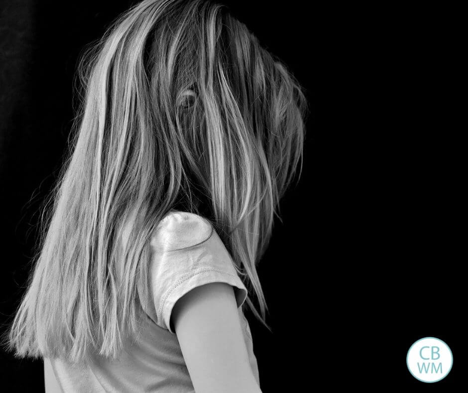 Child with her back to the camera in black and white