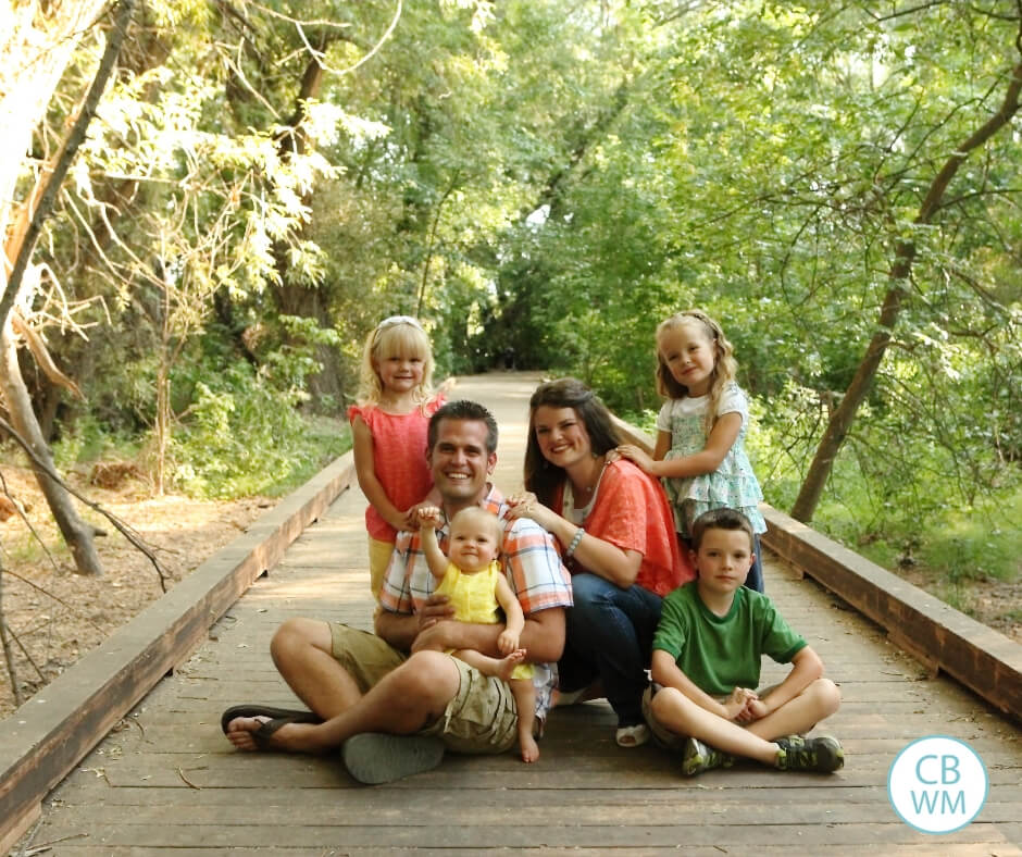 Family on a bridge in the woods