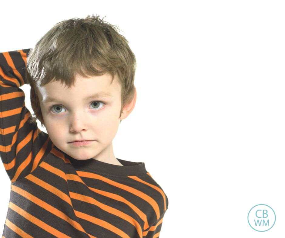 Preschooler looking confused with a solid white background