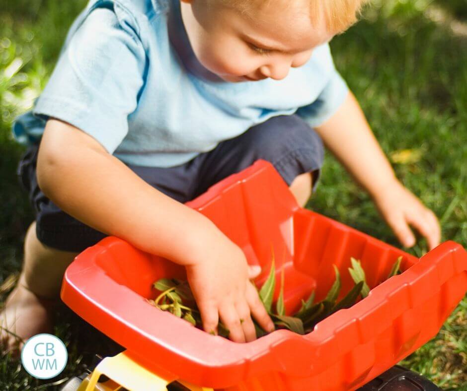 Boy playing with dump truck