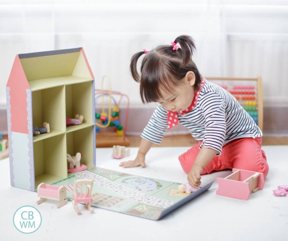 Little girl playing with toys