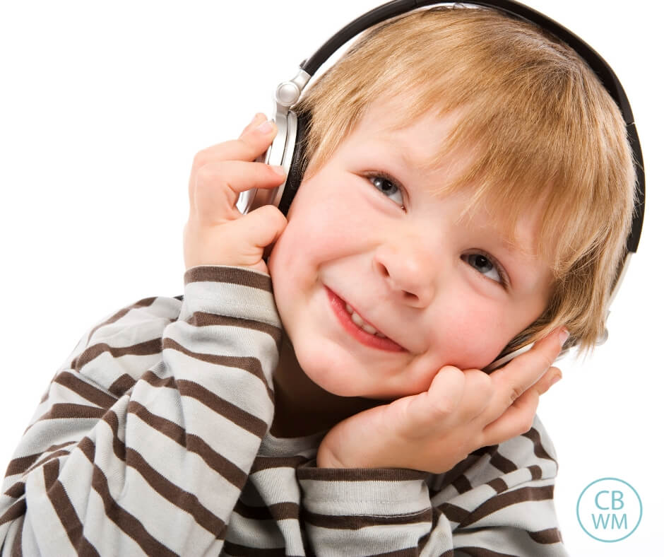 Child listening to headphones