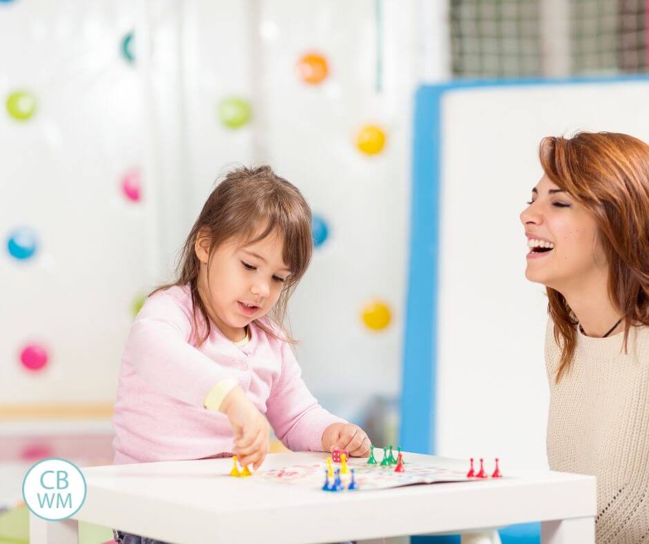 Mother and preschooler playing a game together