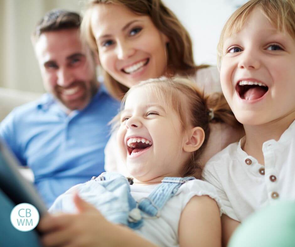 Family of four happy and laughing