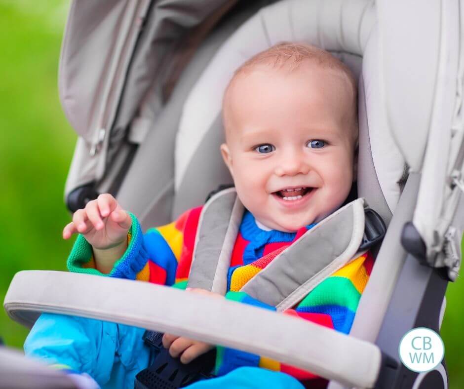 Baby happily sitting in the stroller