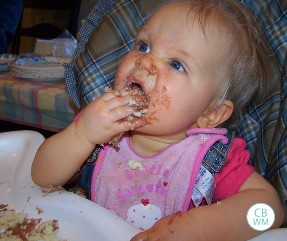 12 month old McKenna eating cake