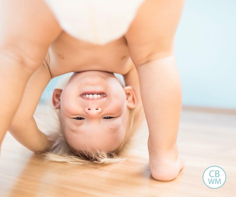 Pretoddler being silly and looking upside down