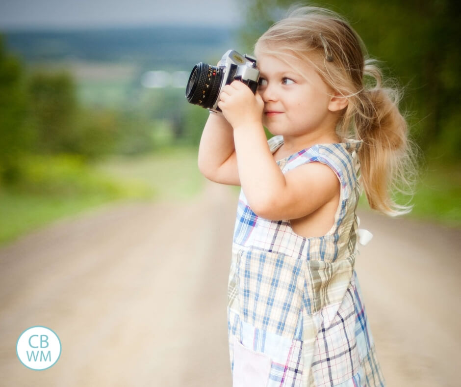 Girl holding camera to her face