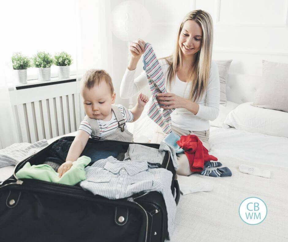 Mom packing for a vacation with her baby