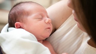 Mother holding new baby