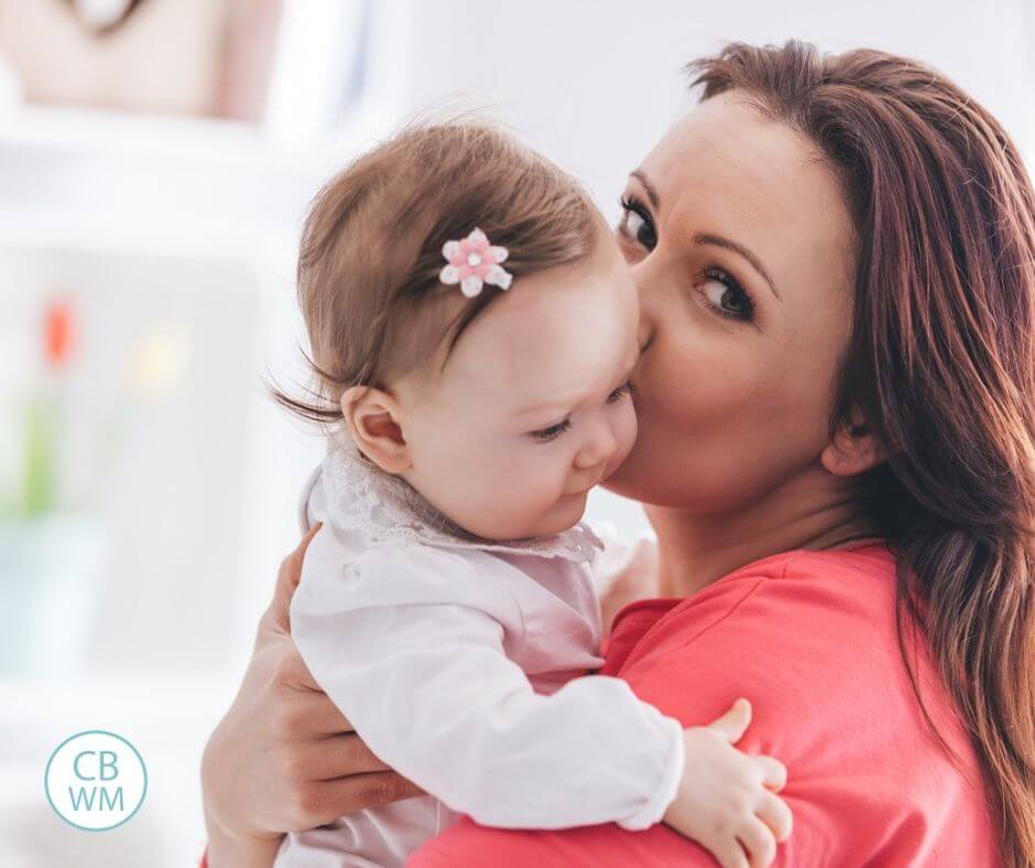 mom kissing baby's cheek