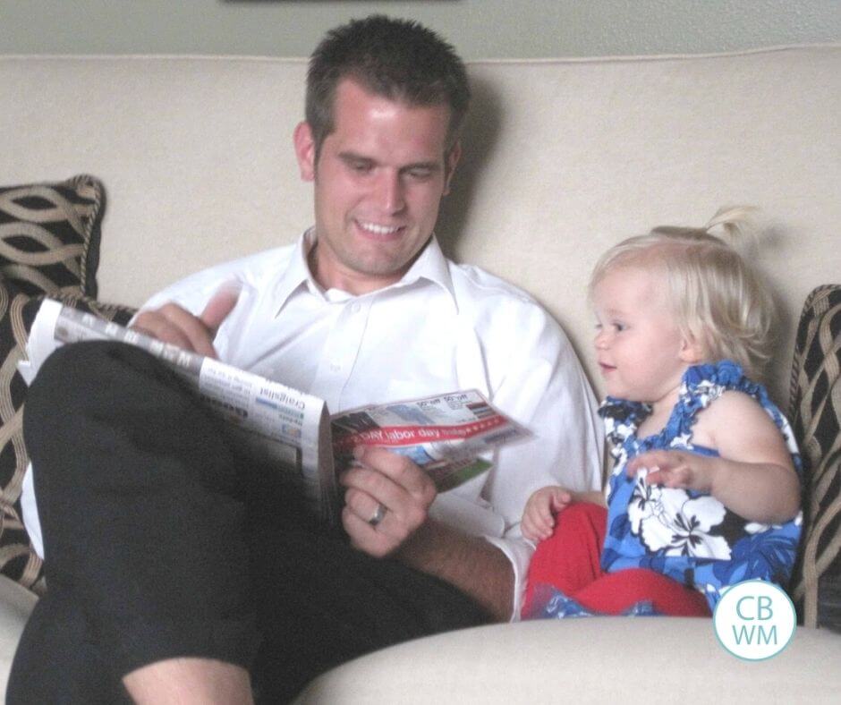 17.5 month old McKenna reading with her dad