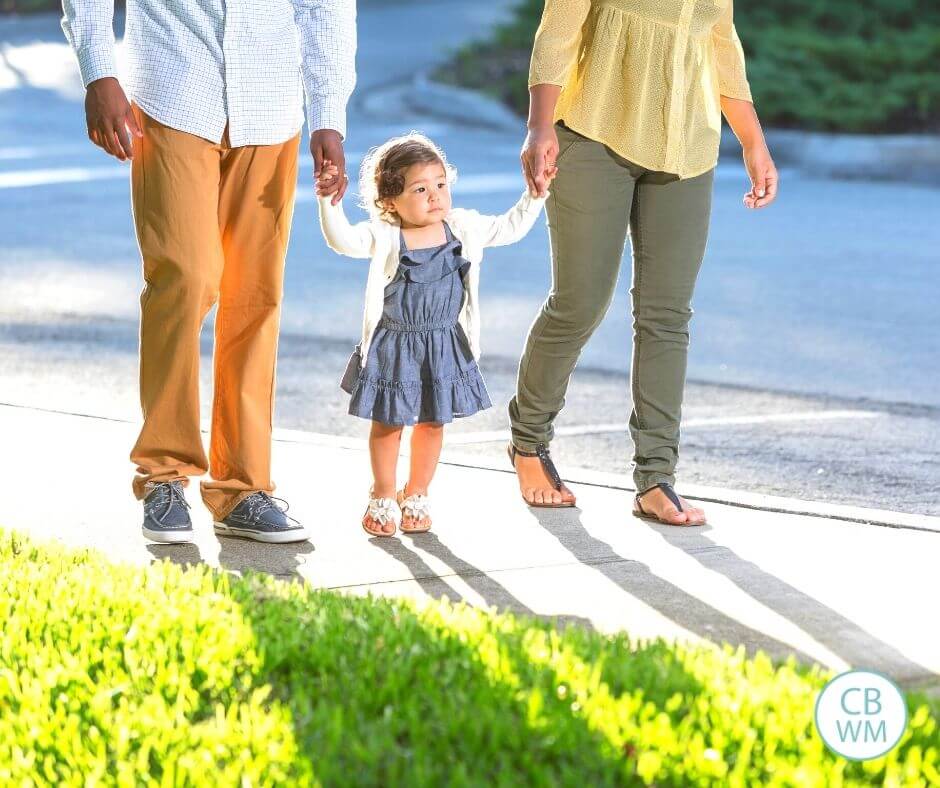 Parents walking with their child