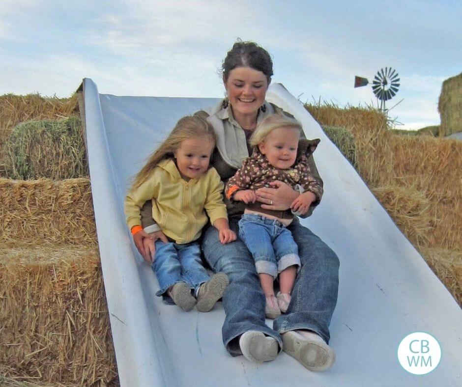 18 month old McKenna with her sister and mom