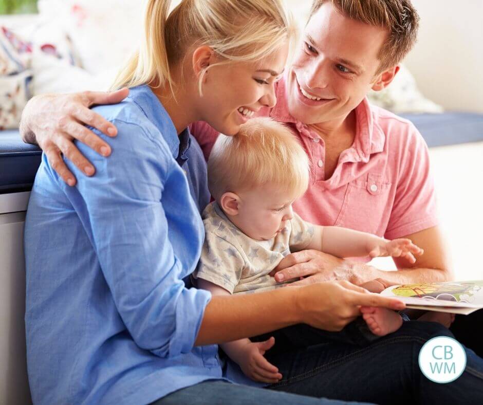 Parents reading to their baby