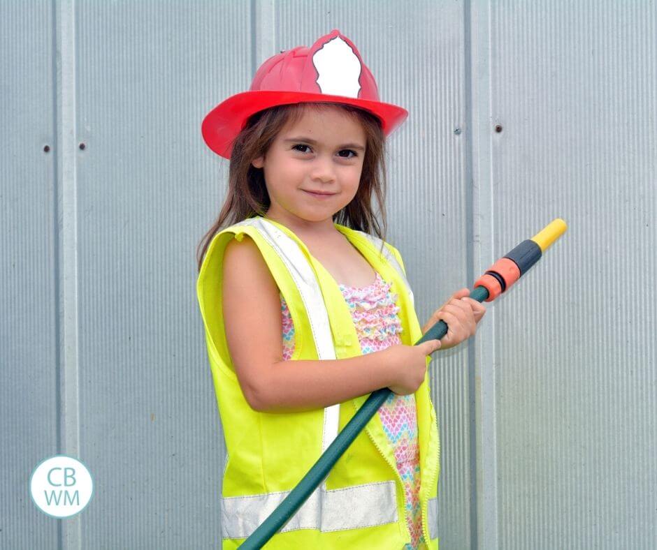 Child learning fire safety at home