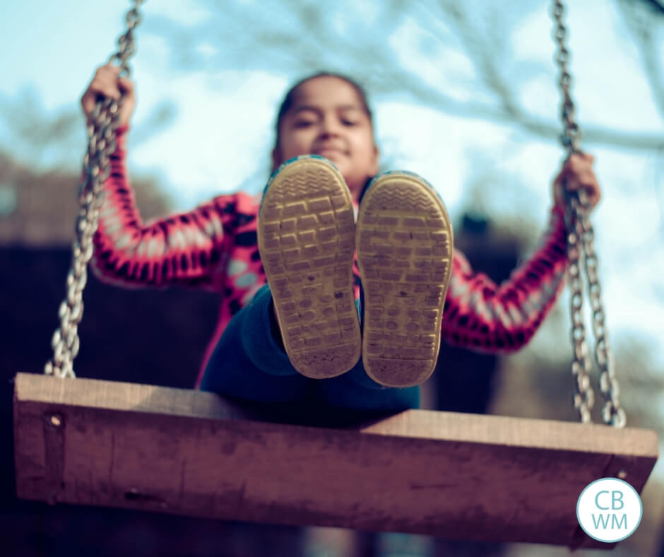Picture of a girl on a swing.