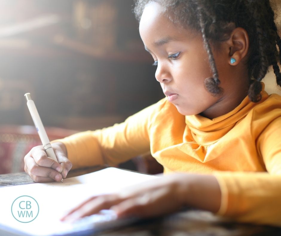 Child writing on paper