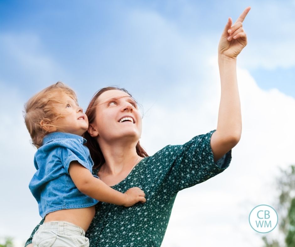 mom and child looking up into the sky