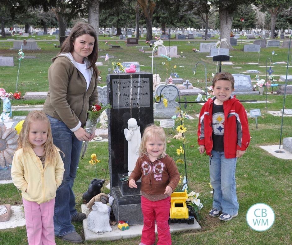 Mom and three children in a cemetery