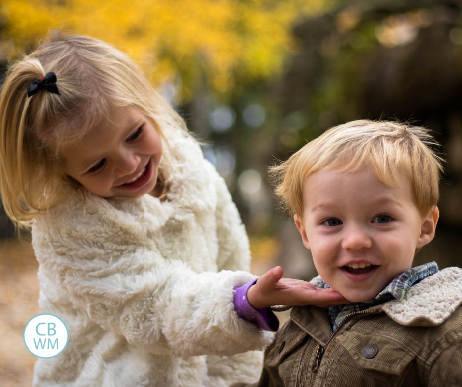 Sister and brother outside together