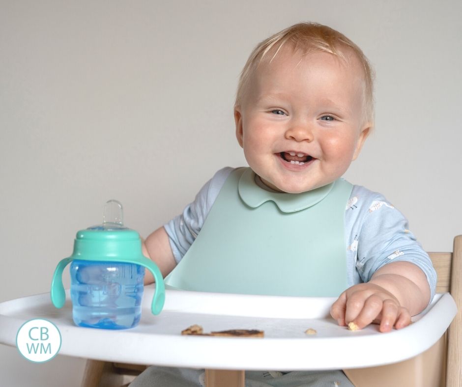 Child eating breakfast in high chair