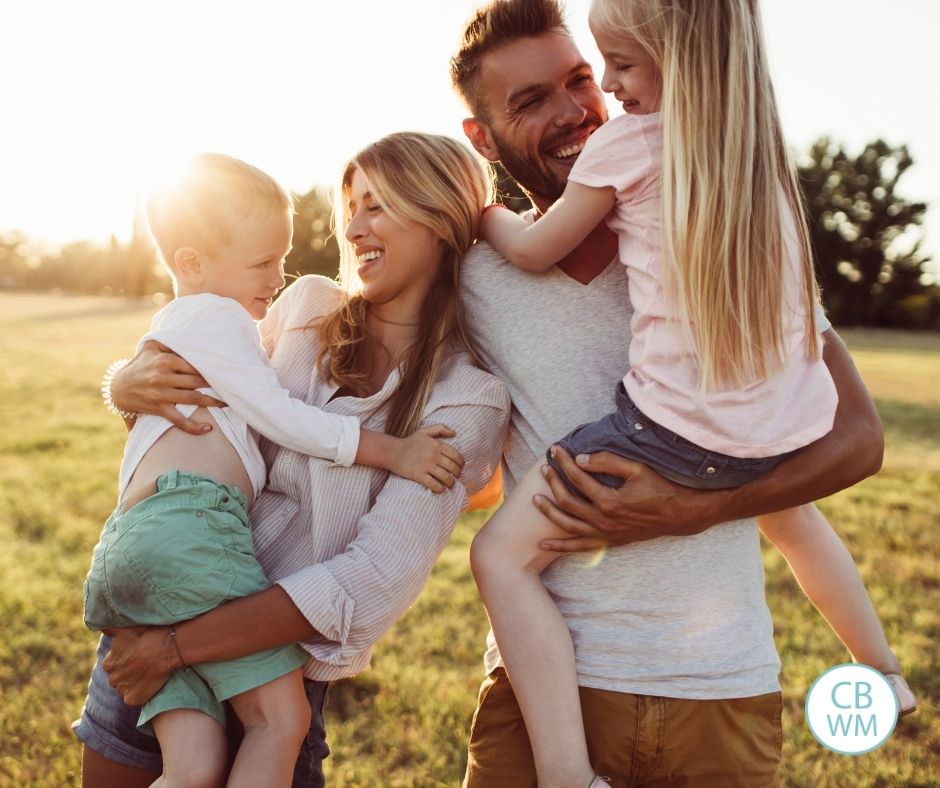 parents with their two kids at sundown