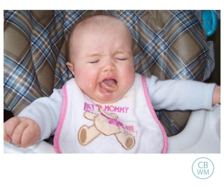 Baby eating fruit for the first time