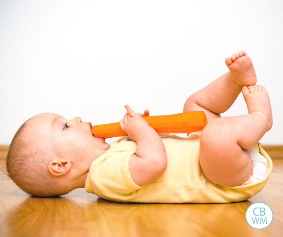 Baby eating a carrot