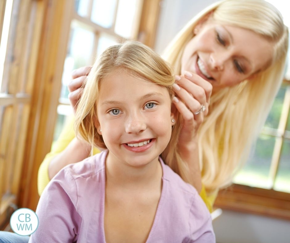 Mom doing daughter's hair