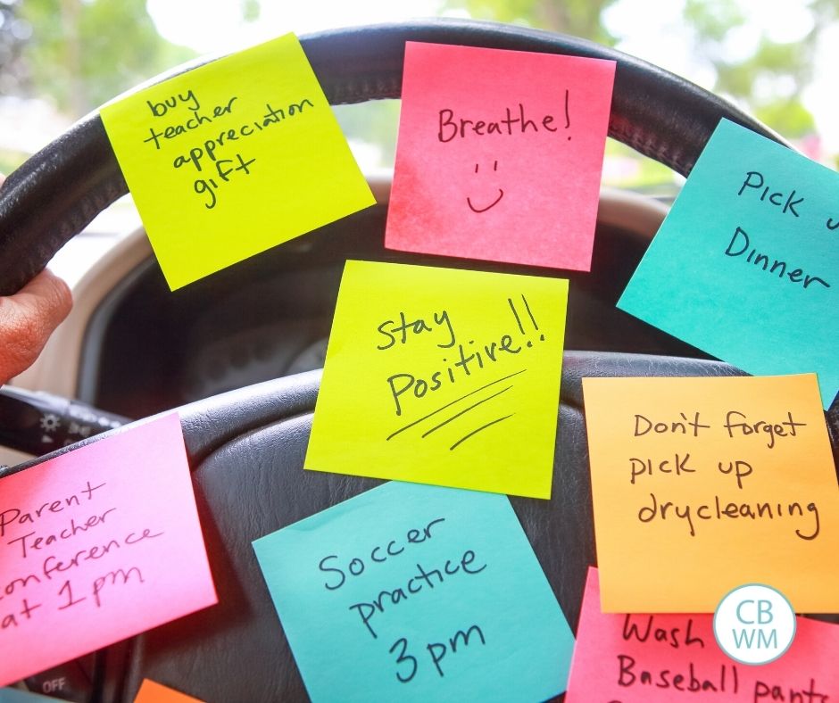 steering wheel covered in sticky notes with reminders