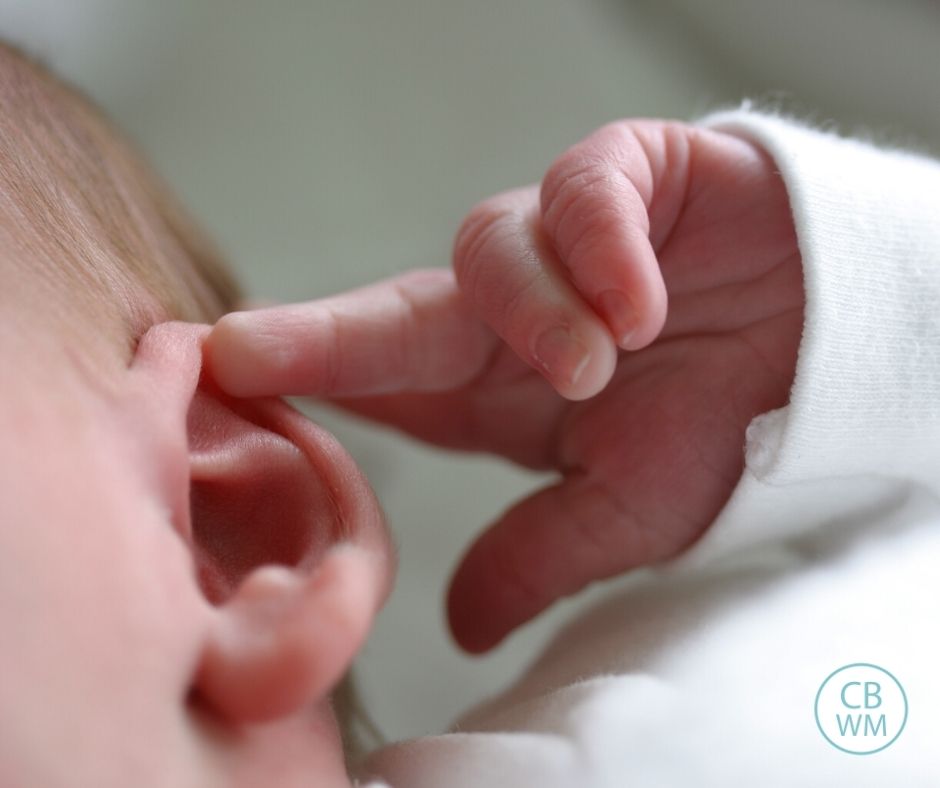 Baby touching his ear