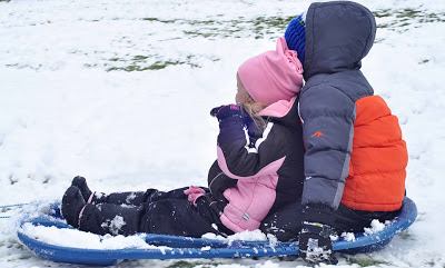 Kaitlyn and Brayden sledding