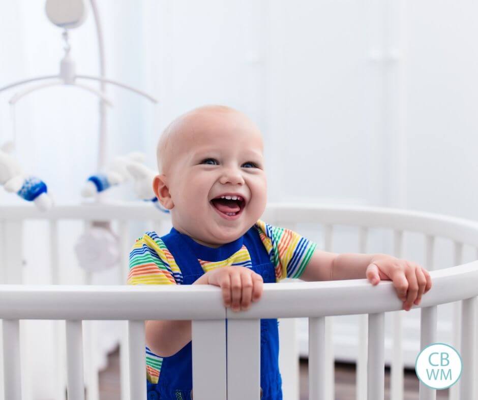 Pretoddler laughing in the crib