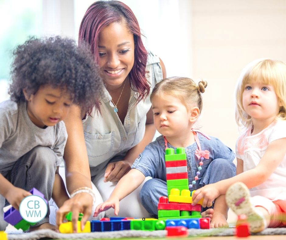 Mom playing with toddlers and preschoolers